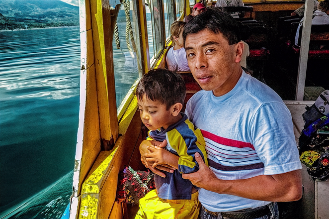 Father and Son Crossing Atitlan-Guatemala